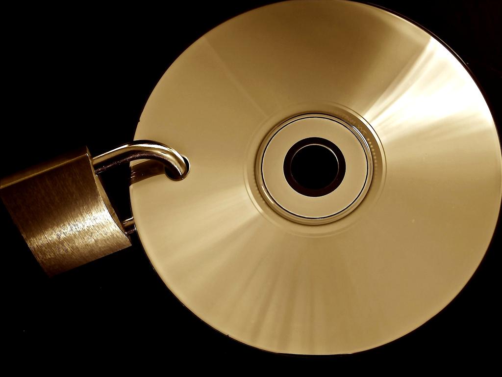 Laptop with photos uploading to cloud backup